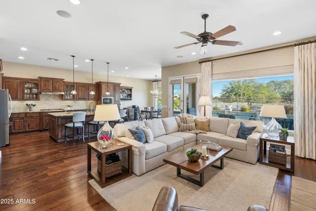 a kitchen with a table chairs sink and cabinets