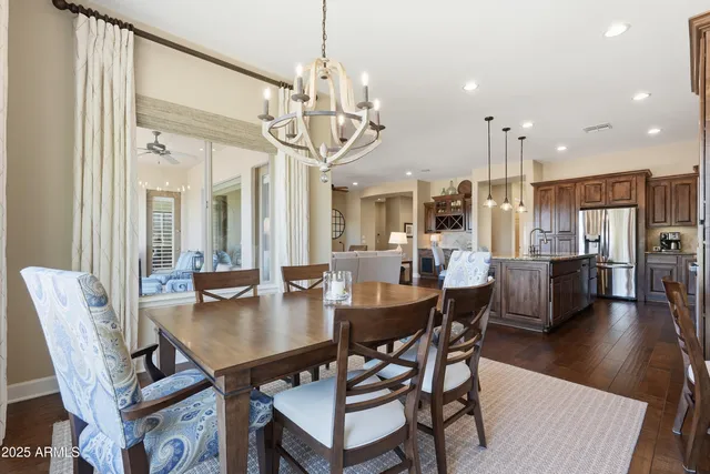 a bedroom with furniture and a flat screen tv