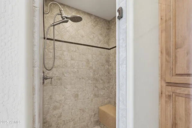 a view of a bedroom with chair and tables in the patio