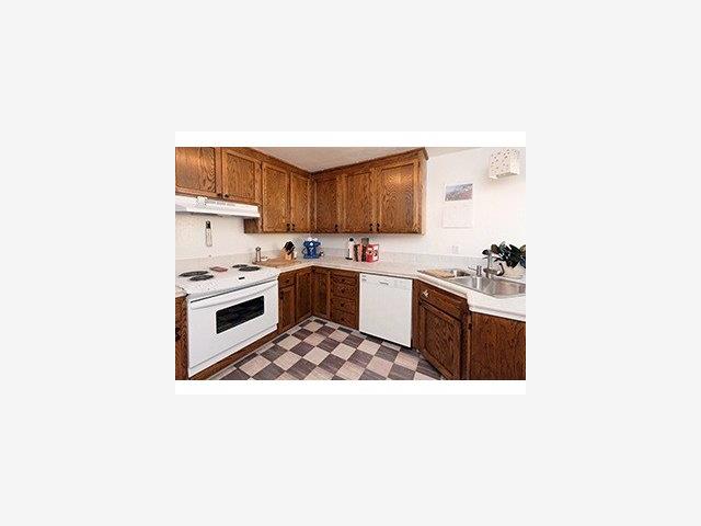 12 B Quien Sabe Road Scotts Valley, CA 95066 - Photo 3 of 6 a kitchen with a stove a sink and a refrigerator