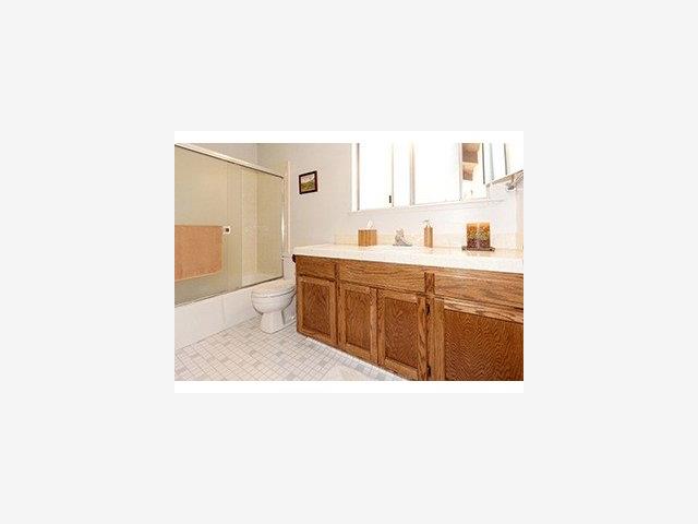 12 B Quien Sabe Road Scotts Valley, CA 95066 - Photo 6 of 6 a bathroom with a sink a toilet and mirror