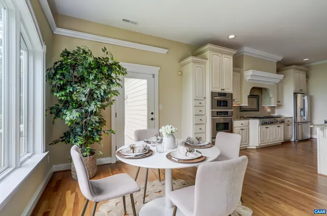 a kitchen with stainless steel appliances granite countertop a stove and a refrigerator