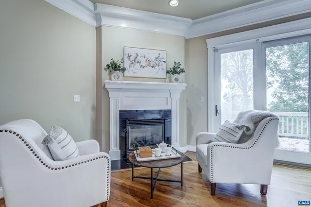 a bathroom with a granite countertop tub double vanity and a mirror