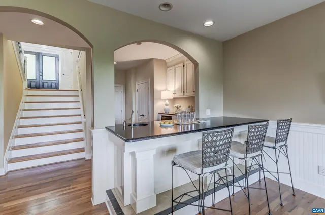 a bedroom with furniture and a chandelier
