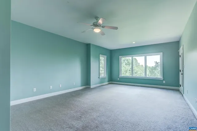 a bathroom with a sink a toilet a mirror a bathtub and shower