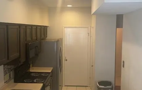 a bathroom with a shower and a sink