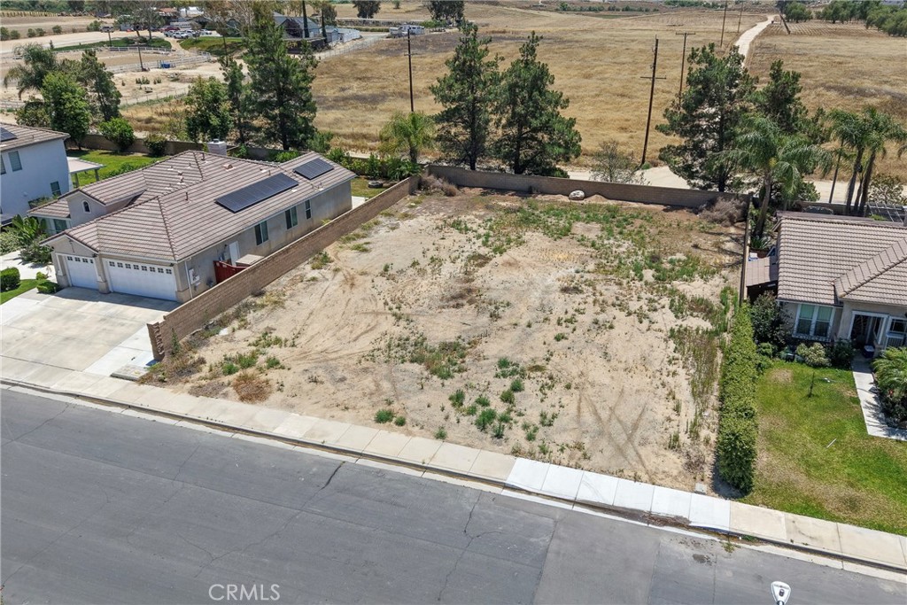 32257 Perigord Road Winchester, CA 92596 - Photo 5 of 19 an aerial view of a house with a yard and large tree