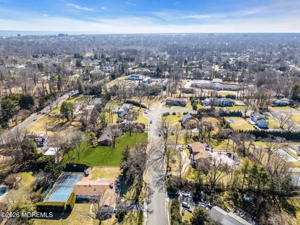 an aerial view of residential building with green space