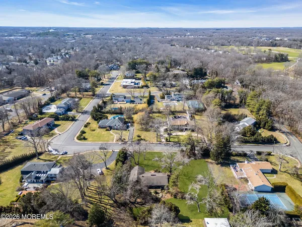 an aerial view of residential building and lake