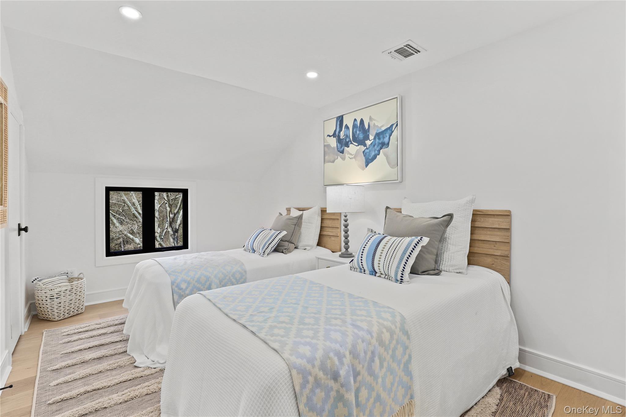 39 Old Snake Hill Road Pound Ridge, NY 10576 - Photo 18 of 37 a bedroom with double bed and a painting
