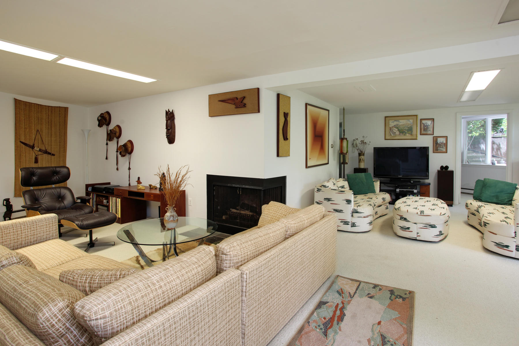 167 Ralyn Road Cotuit, MA 02635 - Photo 17 of 32 a living room with fireplace furniture and a wooden floor