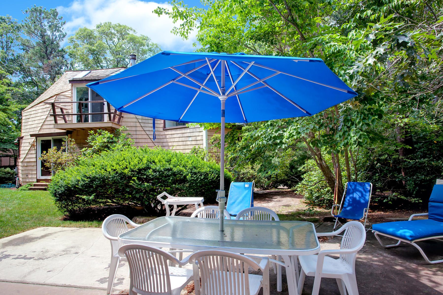 167 Ralyn Road Cotuit, MA 02635 - Photo 2 of 32 a view of backyard of house with seating space
