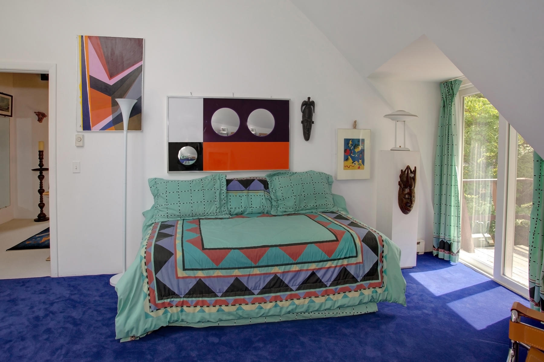 167 Ralyn Road Cotuit, MA 02635 - Photo 23 of 32 a bedroom with a bed painting on wall and a large window