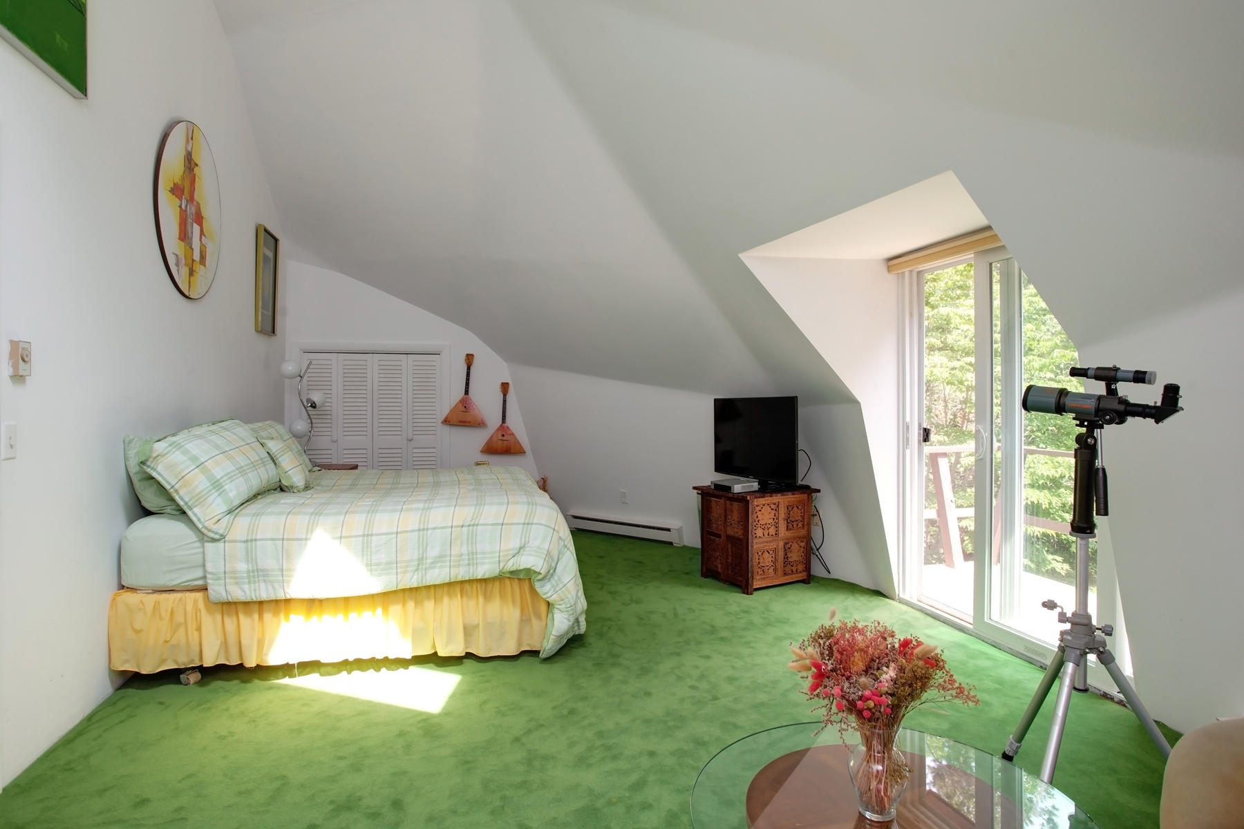 167 Ralyn Road Cotuit, MA 02635 - Photo 27 of 32 a bedroom with bed and a chandelier