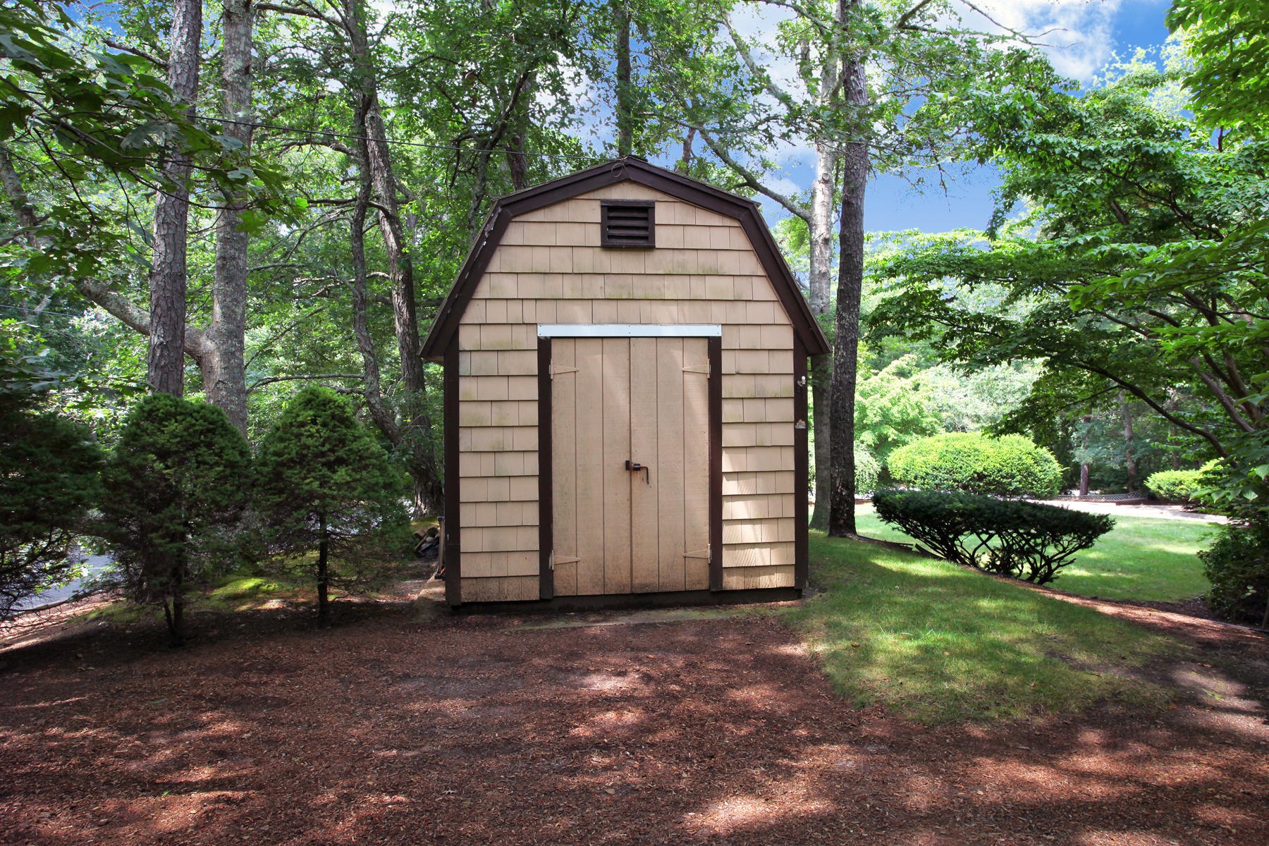 167 Ralyn Road Cotuit, MA 02635 - Photo 30 of 32 a view of a house with a yard