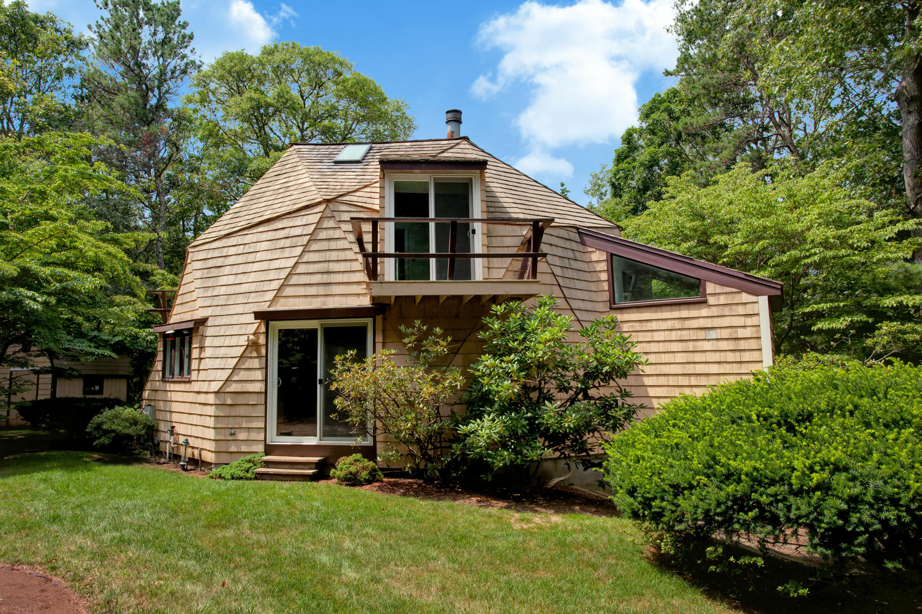 167 Ralyn Road Cotuit, MA 02635 - Photo 4 of 32 a front view of house with a garden