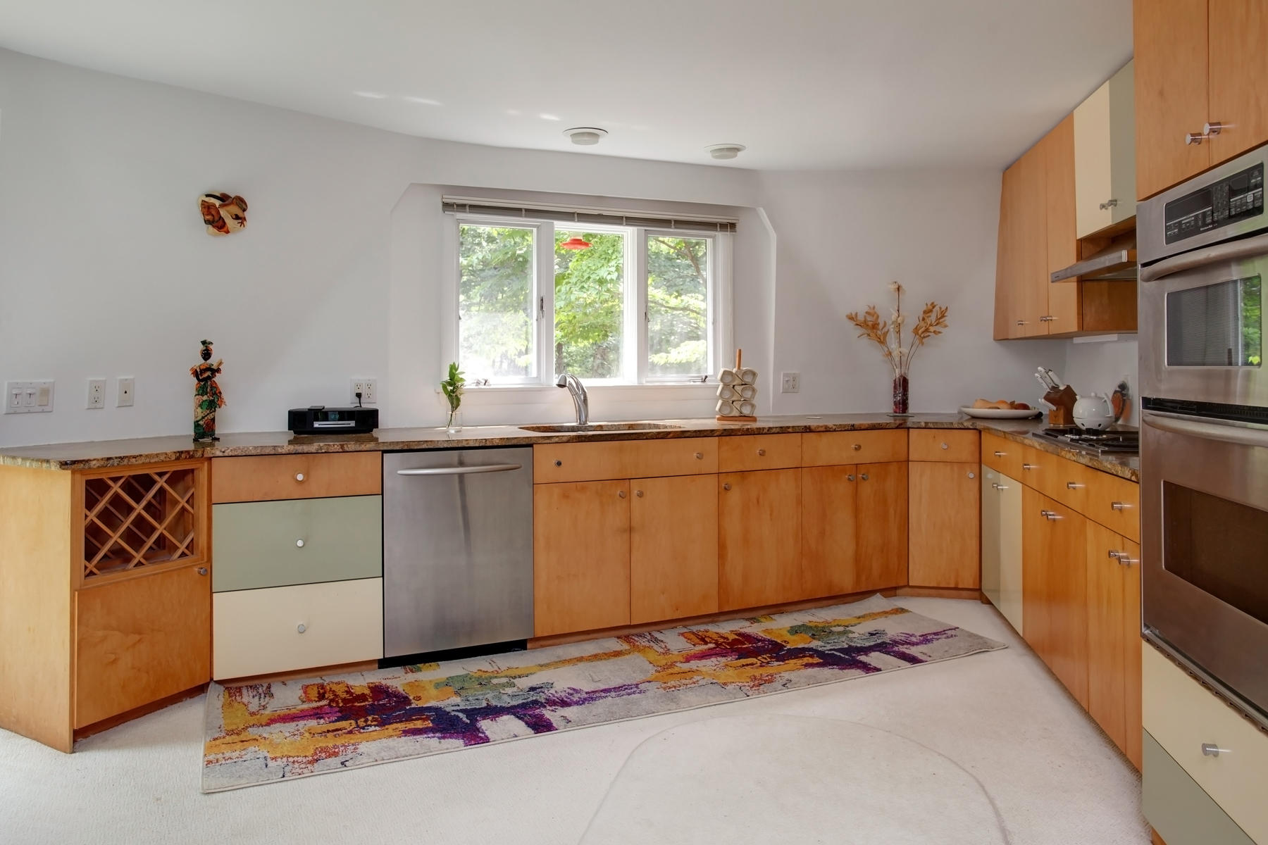 167 Ralyn Road Cotuit, MA 02635 - Photo 5 of 32 a kitchen with a sink stove and cabinets
