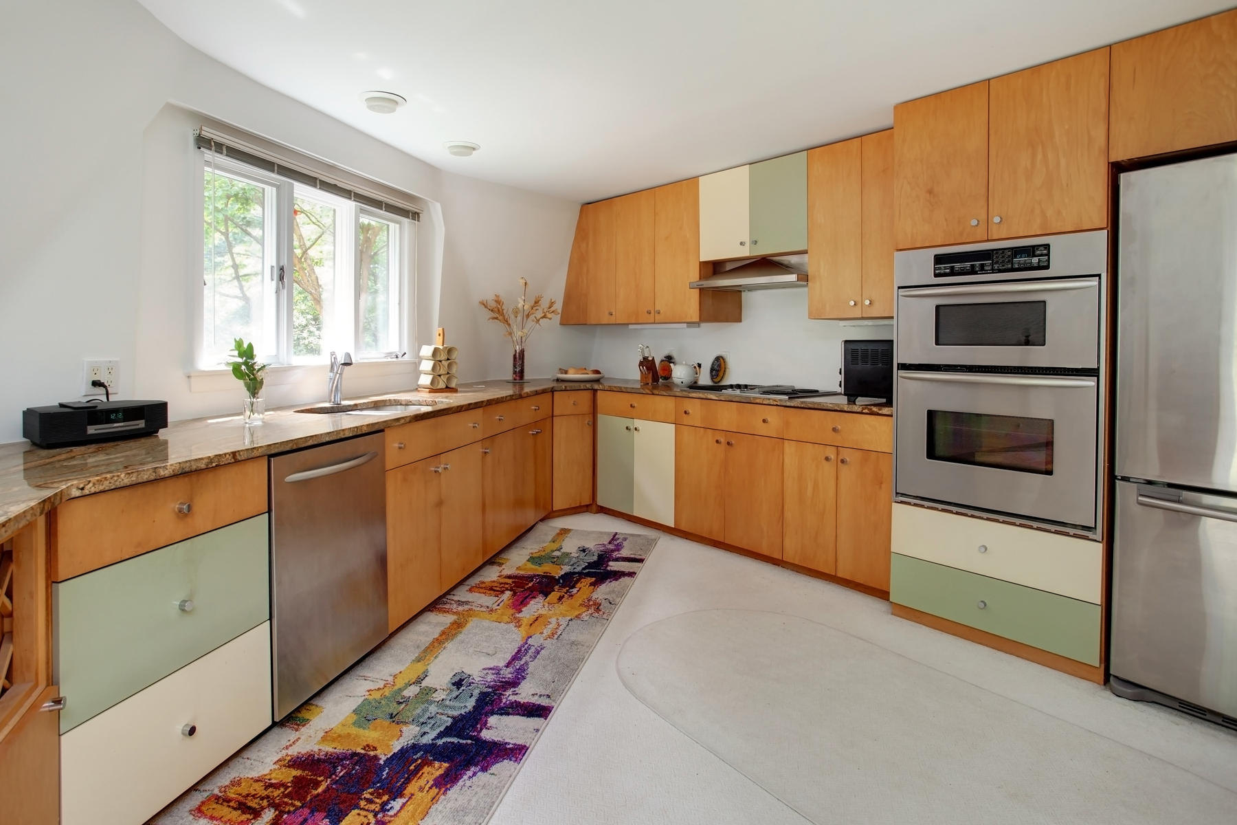 167 Ralyn Road Cotuit, MA 02635 - Photo 6 of 32 a kitchen with stainless steel appliances a sink stove and refrigerator