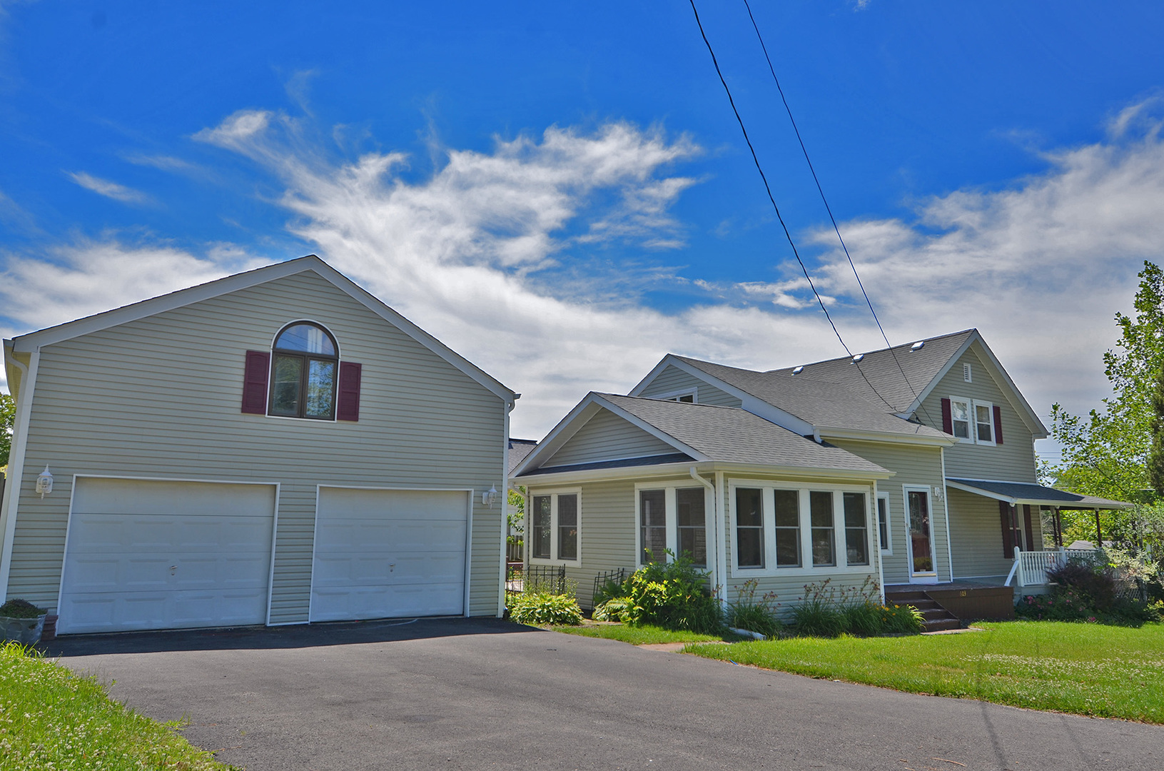603 Clark Street Marseilles, IL 61341 - Photo 1 of 10 a view of a brick house next to a yard with potted plants