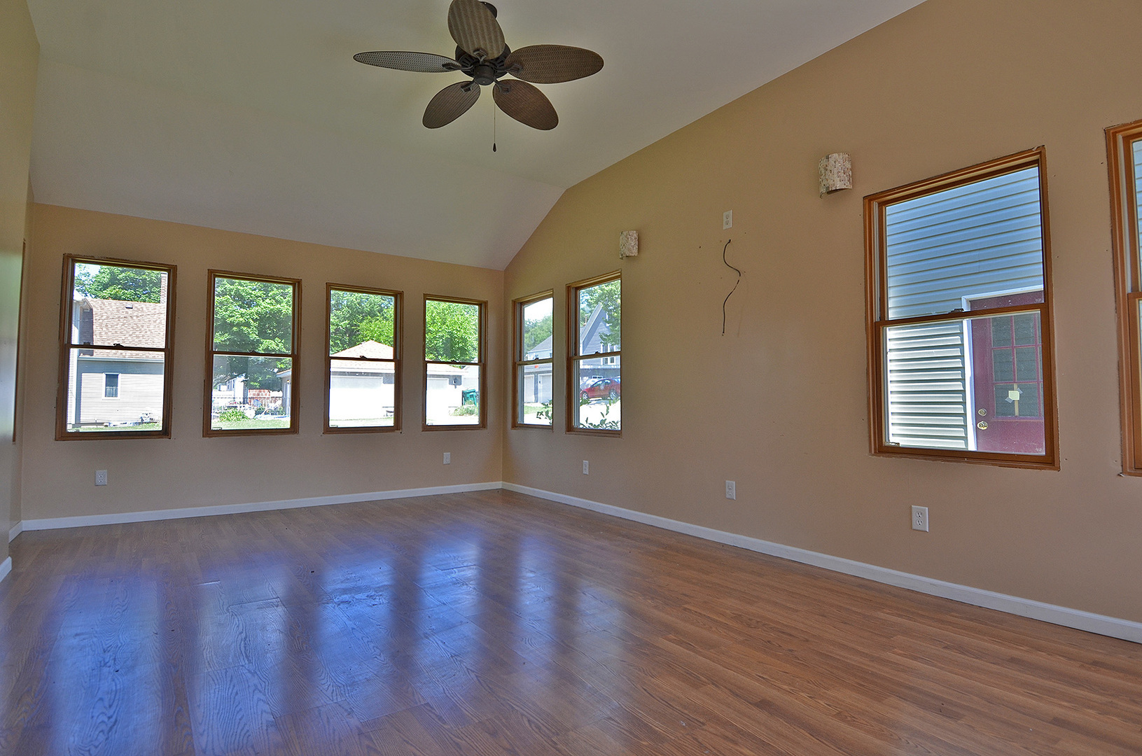 603 Clark Street Marseilles, IL 61341 - Photo 3 of 10 a view of an empty room with a window and wooden floor