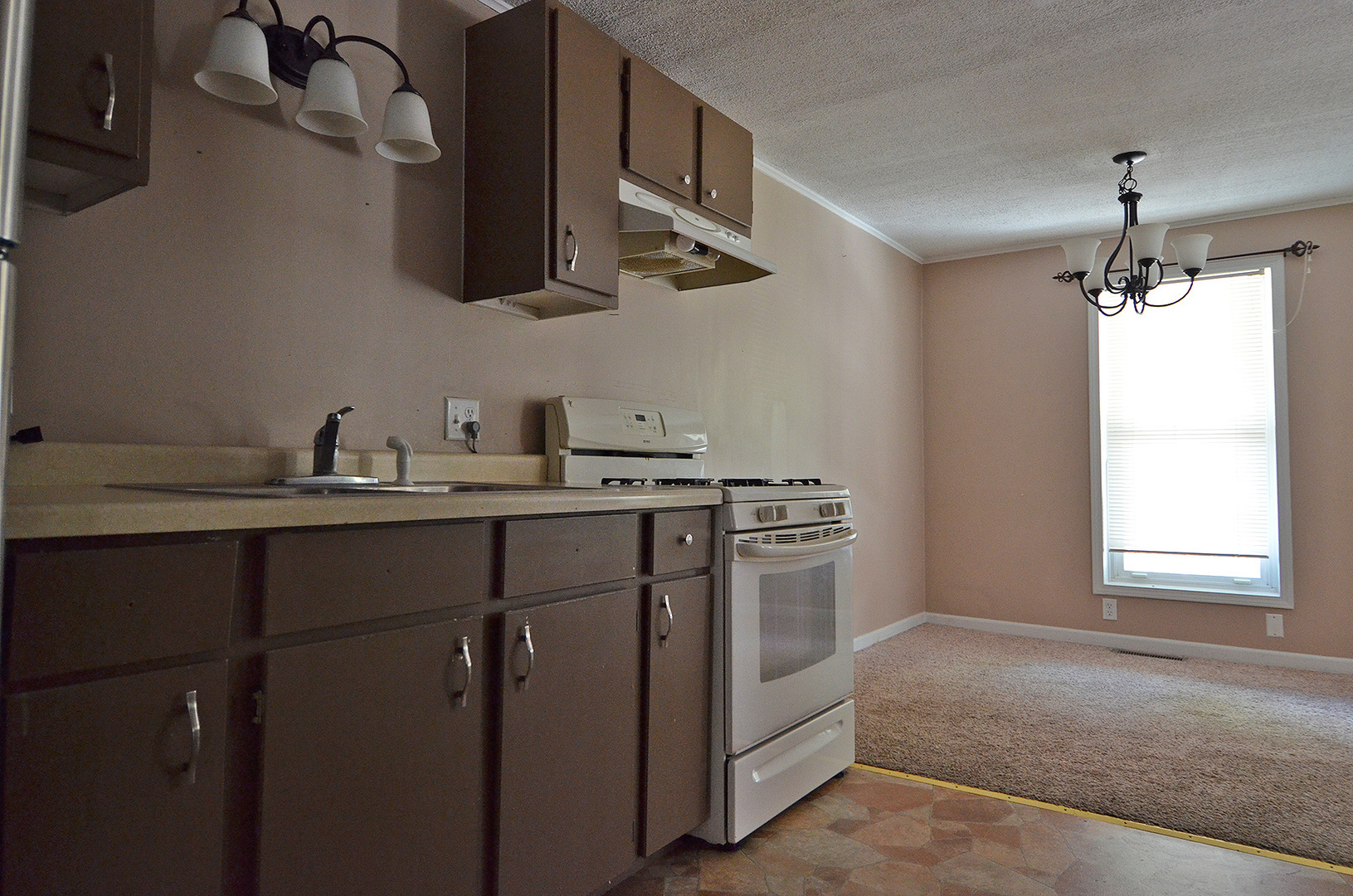 603 Clark Street Marseilles, IL 61341 - Photo 4 of 10 a kitchen with stainless steel appliances a sink stove and refrigerator