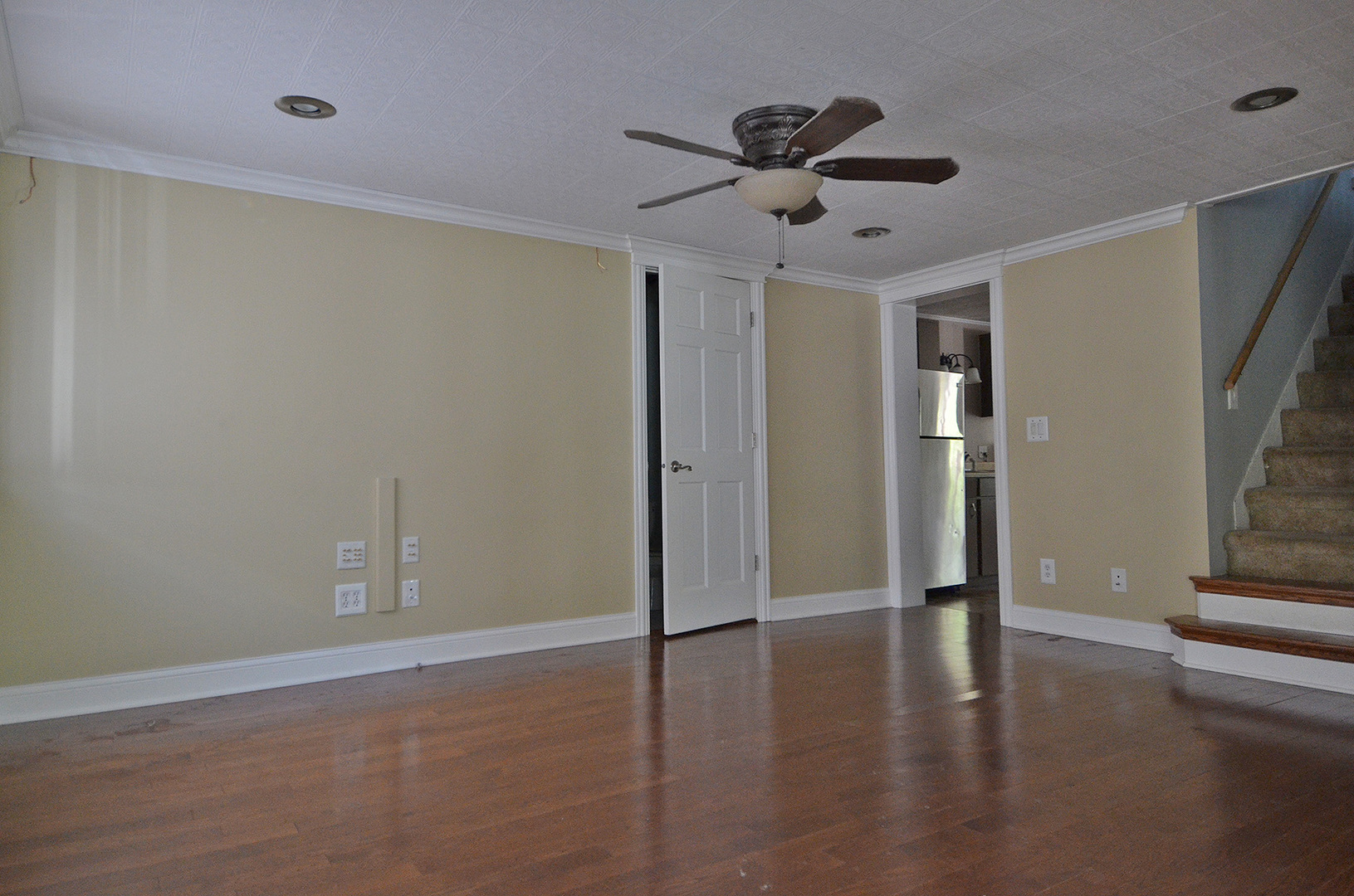 603 Clark Street Marseilles, IL 61341 - Photo 6 of 10 a view of empty room with wooden floor and fan