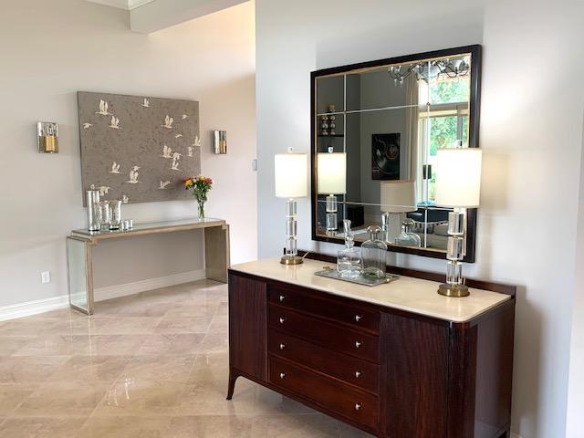 6967 Corning Circle Boynton Beach, FL 33437 - Photo 11 of 62 a bathroom with a tub sink and mirror