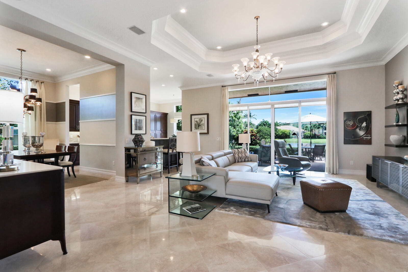 6967 Corning Circle Boynton Beach, FL 33437 - Photo 12 of 62 a living room with furniture a chandelier and a chandelier