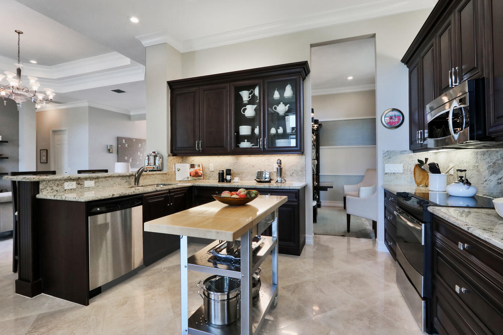 6967 Corning Circle Boynton Beach, FL 33437 - Photo 19 of 62 a kitchen with a sink stove and cabinets