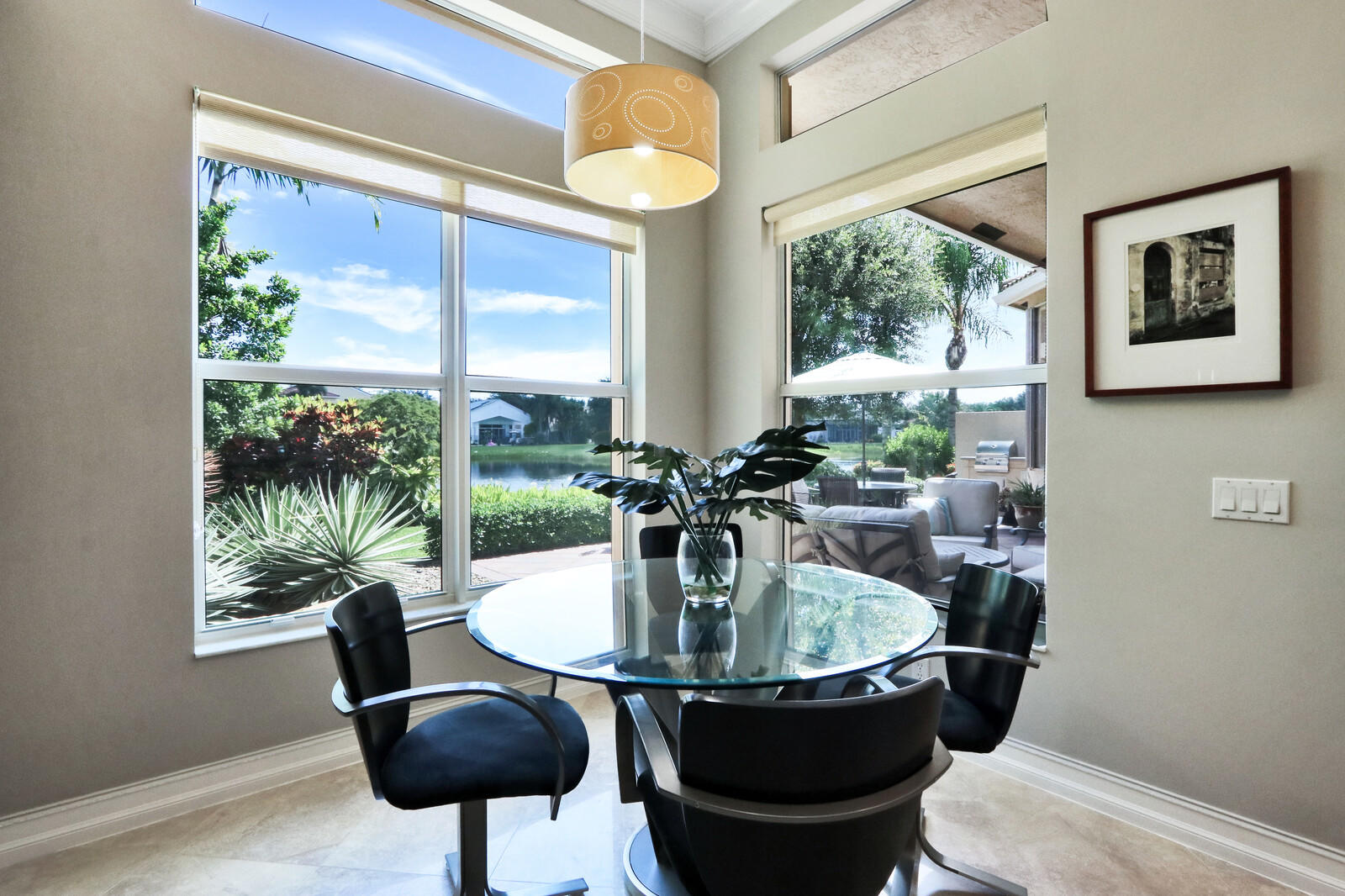 6967 Corning Circle Boynton Beach, FL 33437 - Photo 21 of 62 a kitchen with a table and chairs