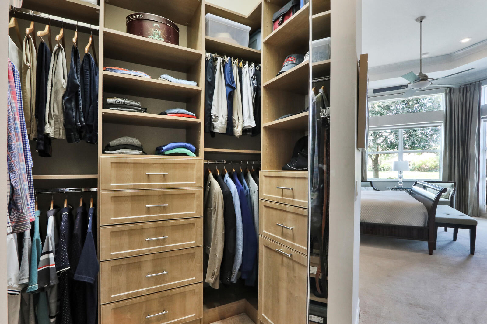6967 Corning Circle Boynton Beach, FL 33437 - Photo 25 of 62 a view of walk in closet with clothes and shoes