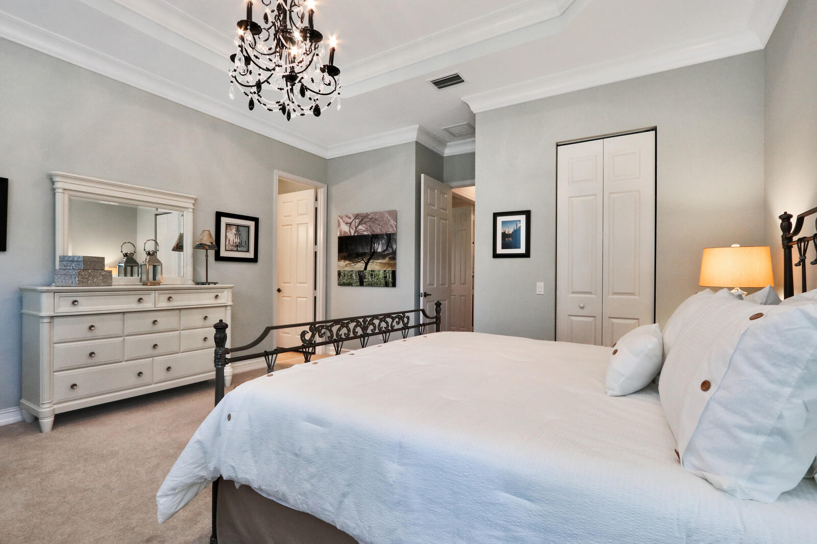 6967 Corning Circle Boynton Beach, FL 33437 - Photo 30 of 62 a bedroom with a bed and a dresser