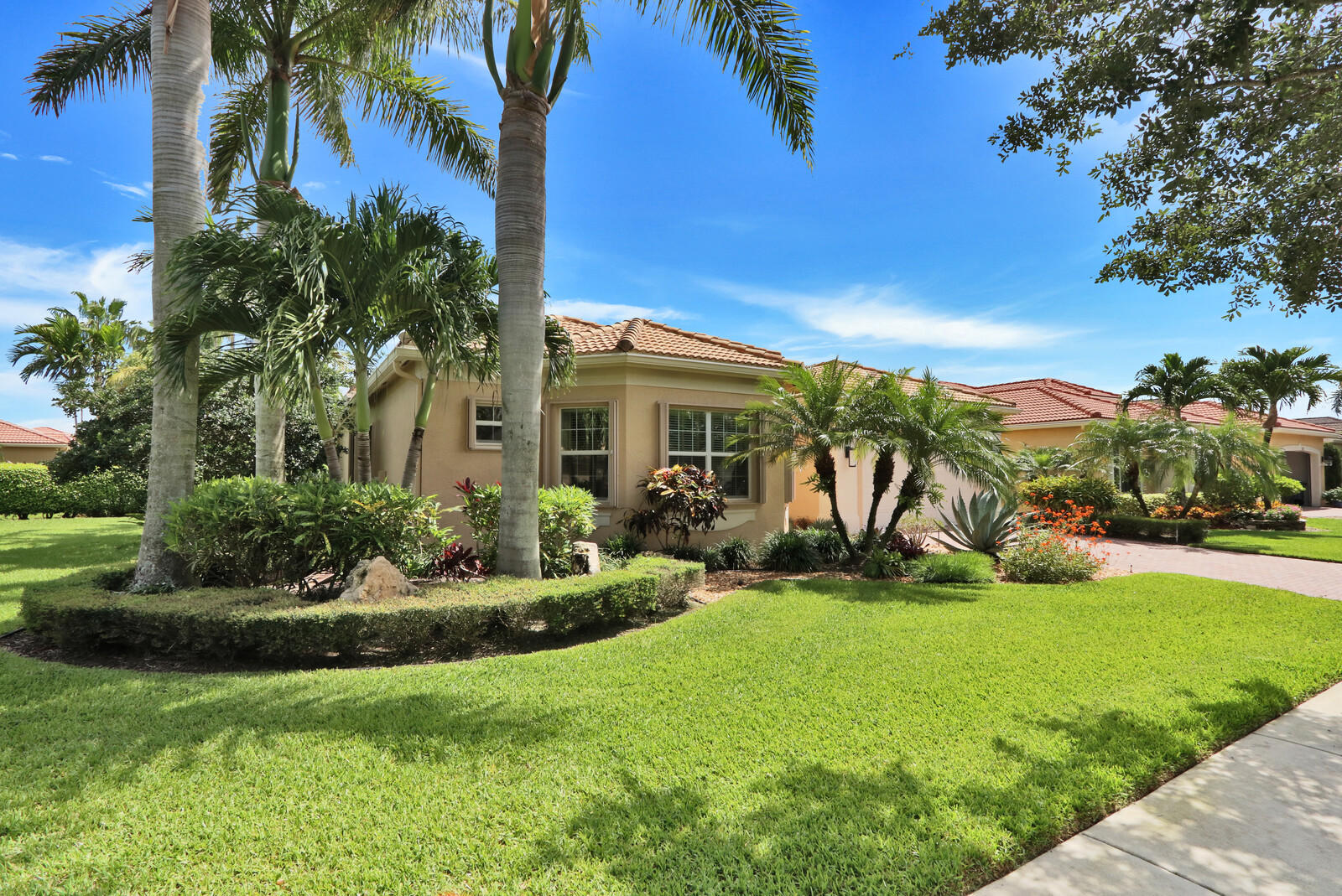 6967 Corning Circle Boynton Beach, FL 33437 - Photo 4 of 62 a view of a house with a yard and potted plants