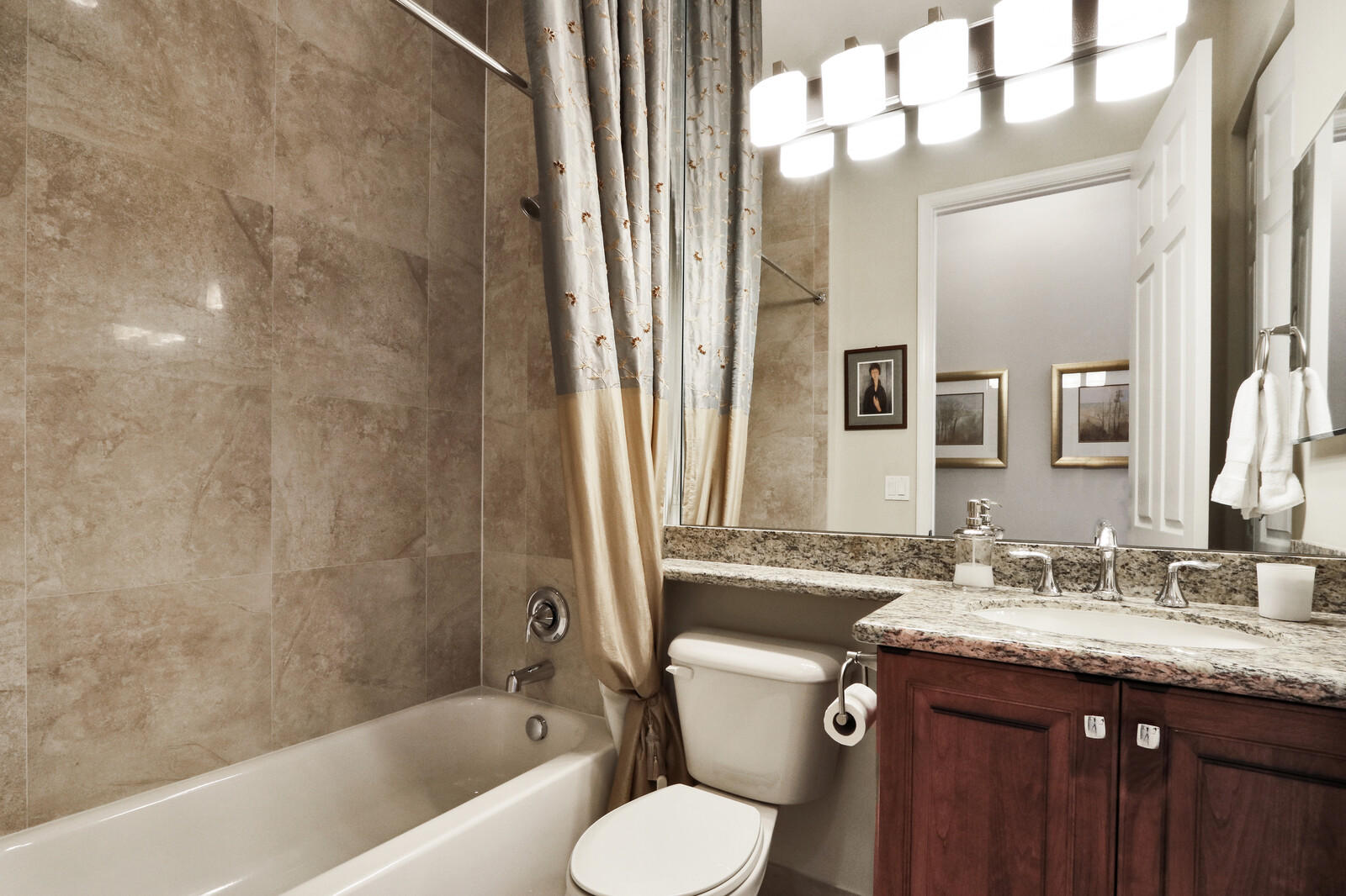 6967 Corning Circle Boynton Beach, FL 33437 - Photo 34 of 62 a bathroom with a granite countertop sink toilet and shower