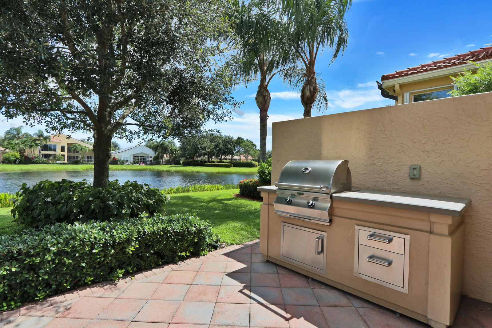 6967 Corning Circle Boynton Beach, FL 33437 - Photo 39 of 62 a view of a yard with an outdoor space