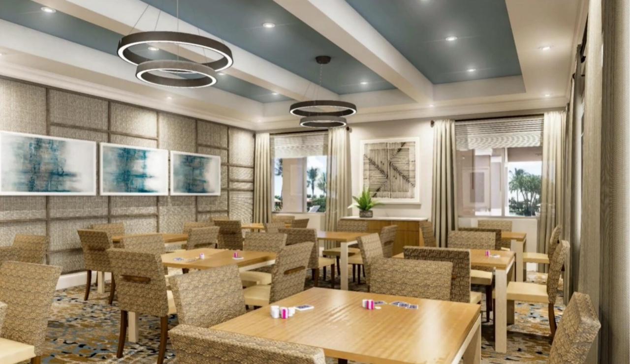 6967 Corning Circle Boynton Beach, FL 33437 - Photo 52 of 62 a view of a dining room with furniture window and outside view