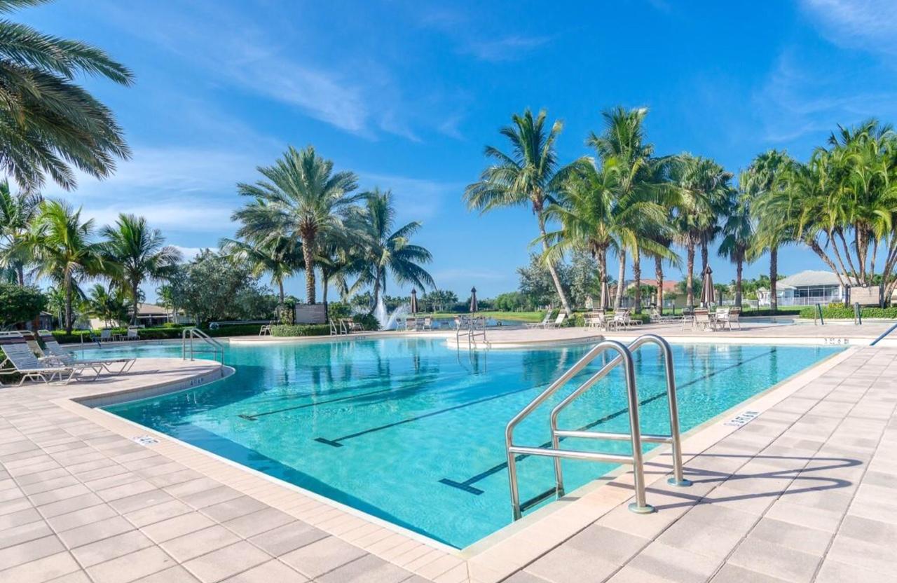 6967 Corning Circle Boynton Beach, FL 33437 - Photo 61 of 62 a view of a backyard with palm trees