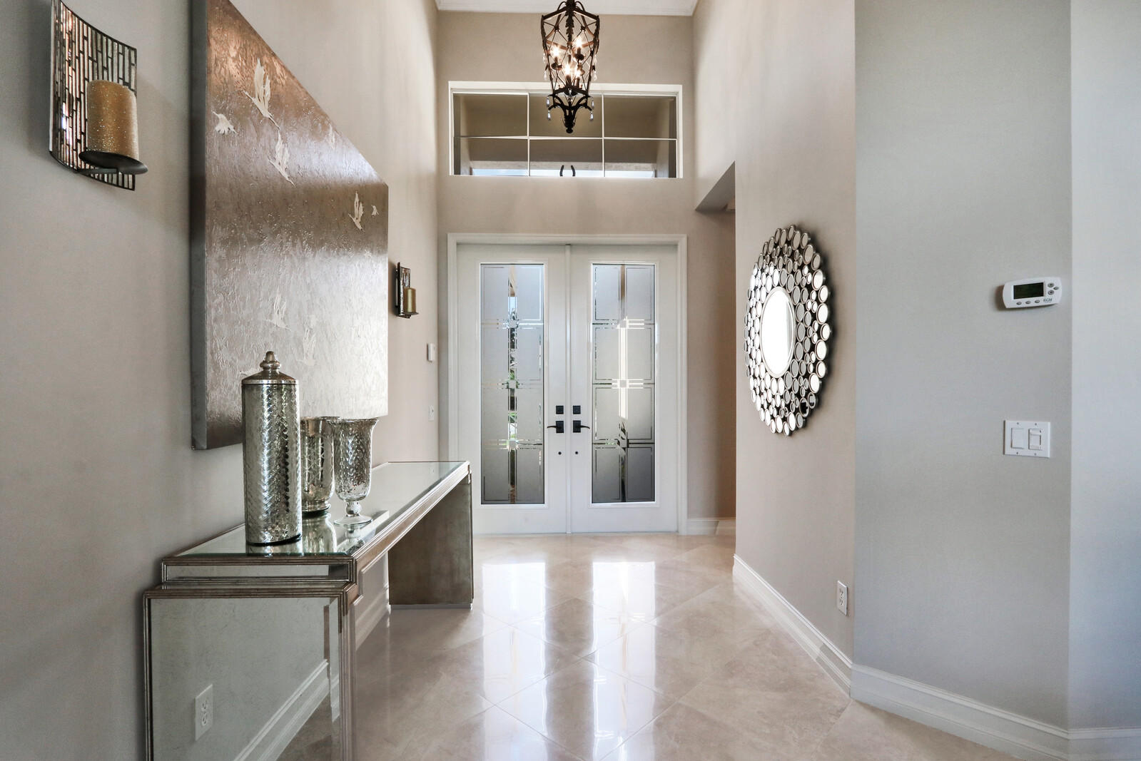 6967 Corning Circle Boynton Beach, FL 33437 - Photo 10 of 62 a view of a hallway with entryway windows
