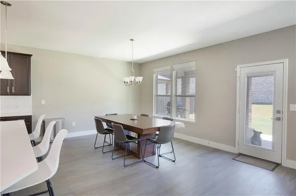 a view of a dining room with furniture and window