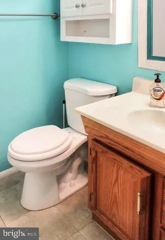 a bathroom with a toilet and a sink