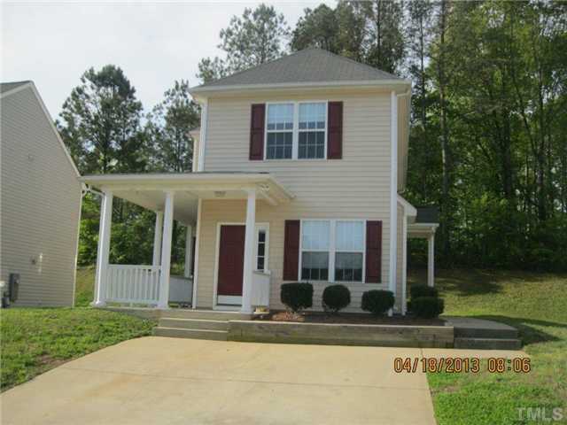 5908 Wynmore Road Raleigh, NC 27610 - Photo 1 of 7 front view of a house with a yard
