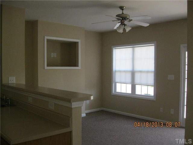 5908 Wynmore Road Raleigh, NC 27610 - Photo 3 of 7 a view of an empty room with a window