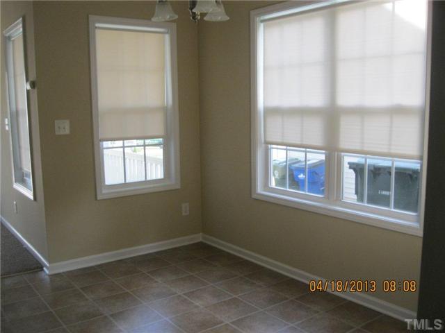5908 Wynmore Road Raleigh, NC 27610 - Photo 5 of 7 an empty room with a window