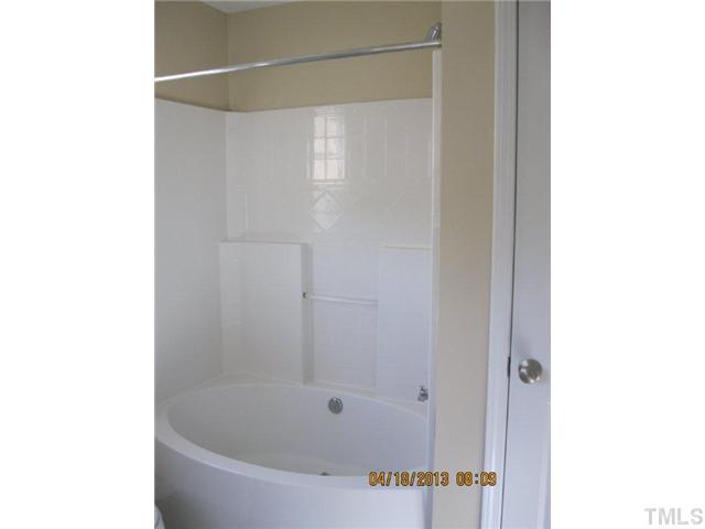 5908 Wynmore Road Raleigh, NC 27610 - Photo 6 of 7 a bathroom with a bathtub