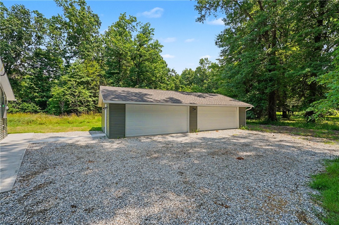 7583 Yale Road Atwater, OH 44201 - Photo 6 of 41 Almost brand new construction 4 car detached garage. The only original parts of the garage are some wood sheathing, roof rafters, and exterior walls. Everything is brand new in the interior and exterior.