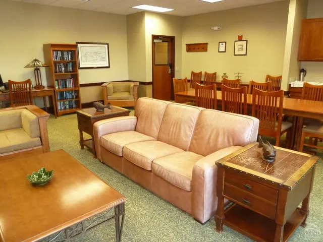 a view of a workspace with furniture