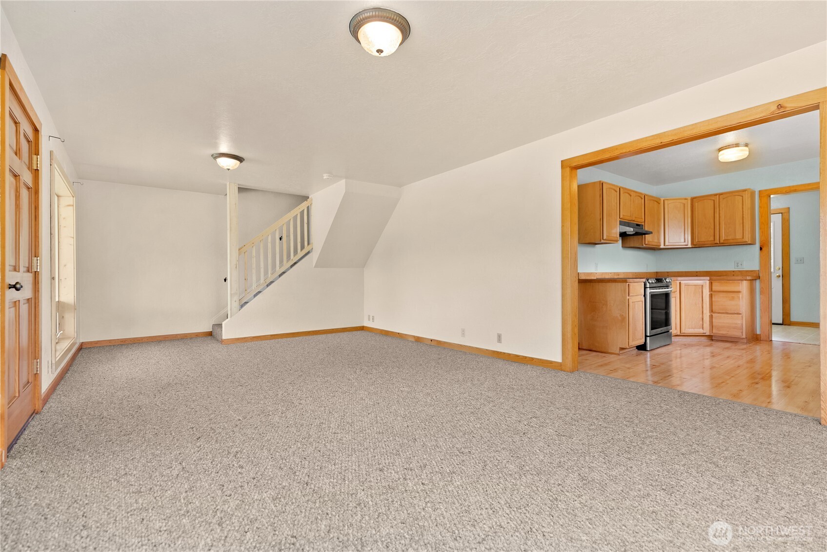 511 Bluff Street Winthrop, WA 98862 - Photo 8 of 38 a view of a livingroom with wooden floor and staircase