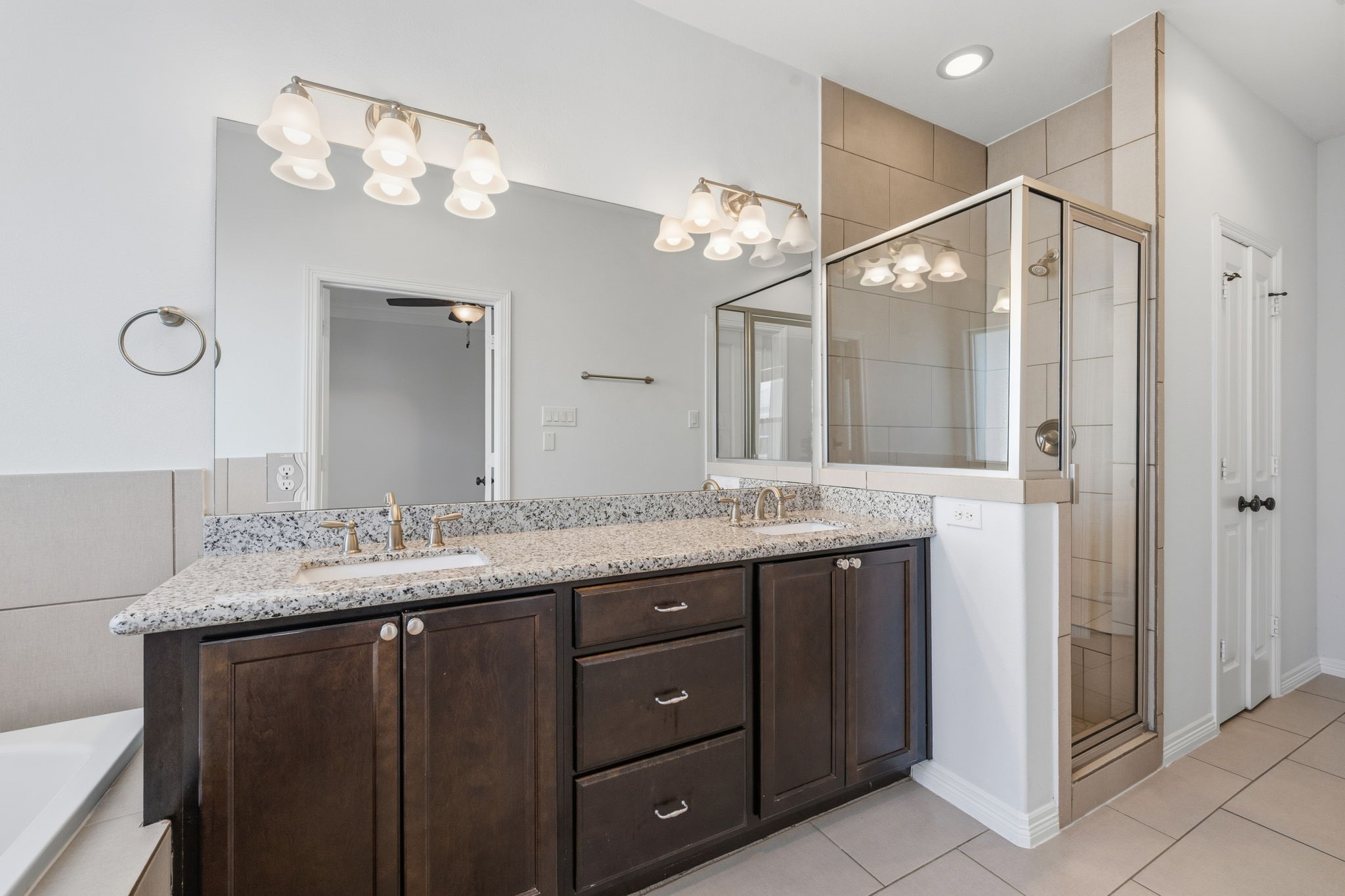 617 West 24th Street Houston, TX 77008 - Photo 21 of 28 a bathroom with a granite countertop sink a mirror and a shower