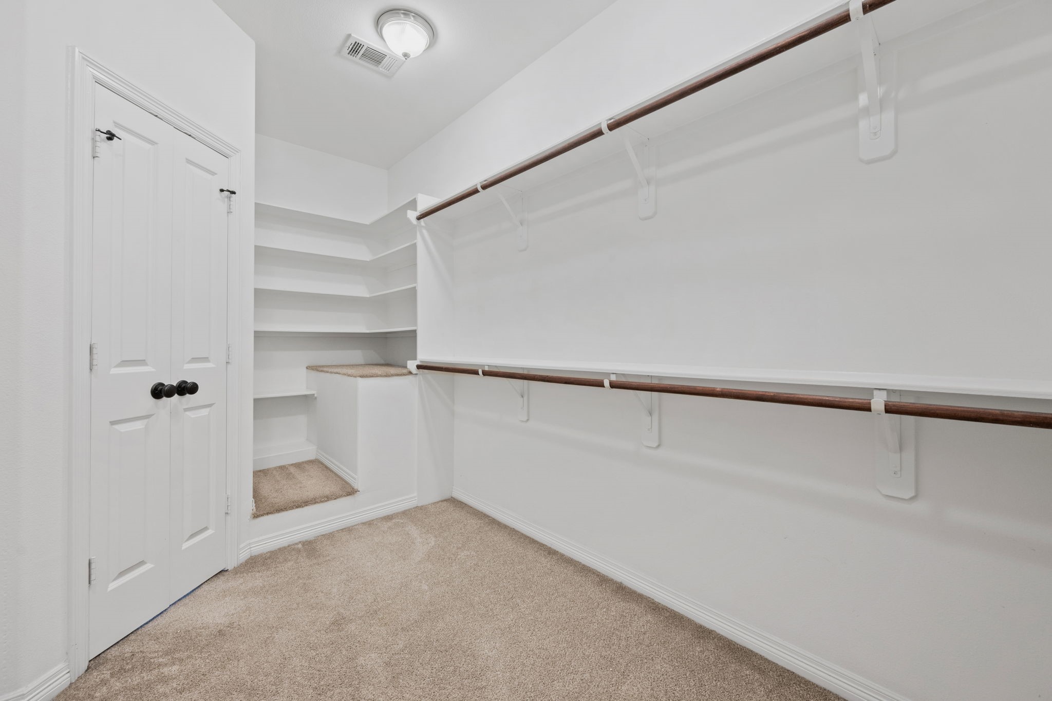 617 West 24th Street Houston, TX 77008 - Photo 23 of 28 a view of walk in closet with empty racks