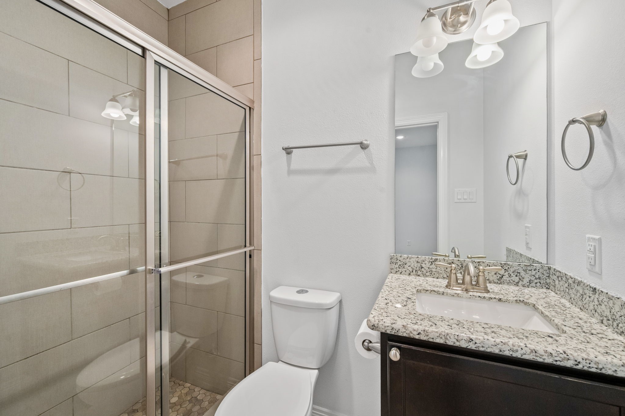 617 West 24th Street Houston, TX 77008 - Photo 6 of 28 a bathroom with a granite countertop sink toilet and shower